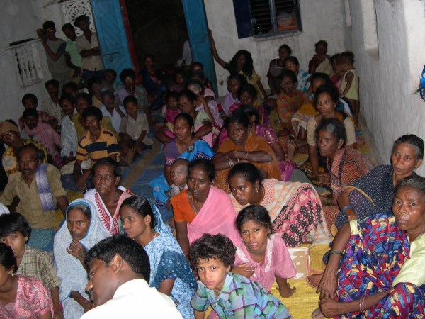 Tribal people watching the Jesus story